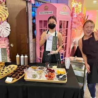 Serving at an event booth — everyone builds their own bowl