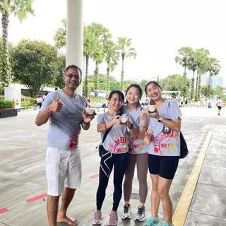 Event participants with açaí in hand