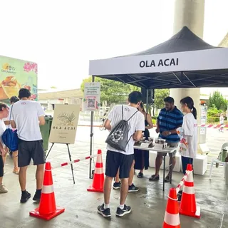 Two Olá Açaí tents at a sports event