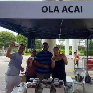 Group photo at the booth after a long, hot event day